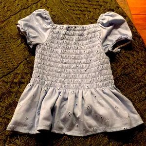 a cropped tunic flower top